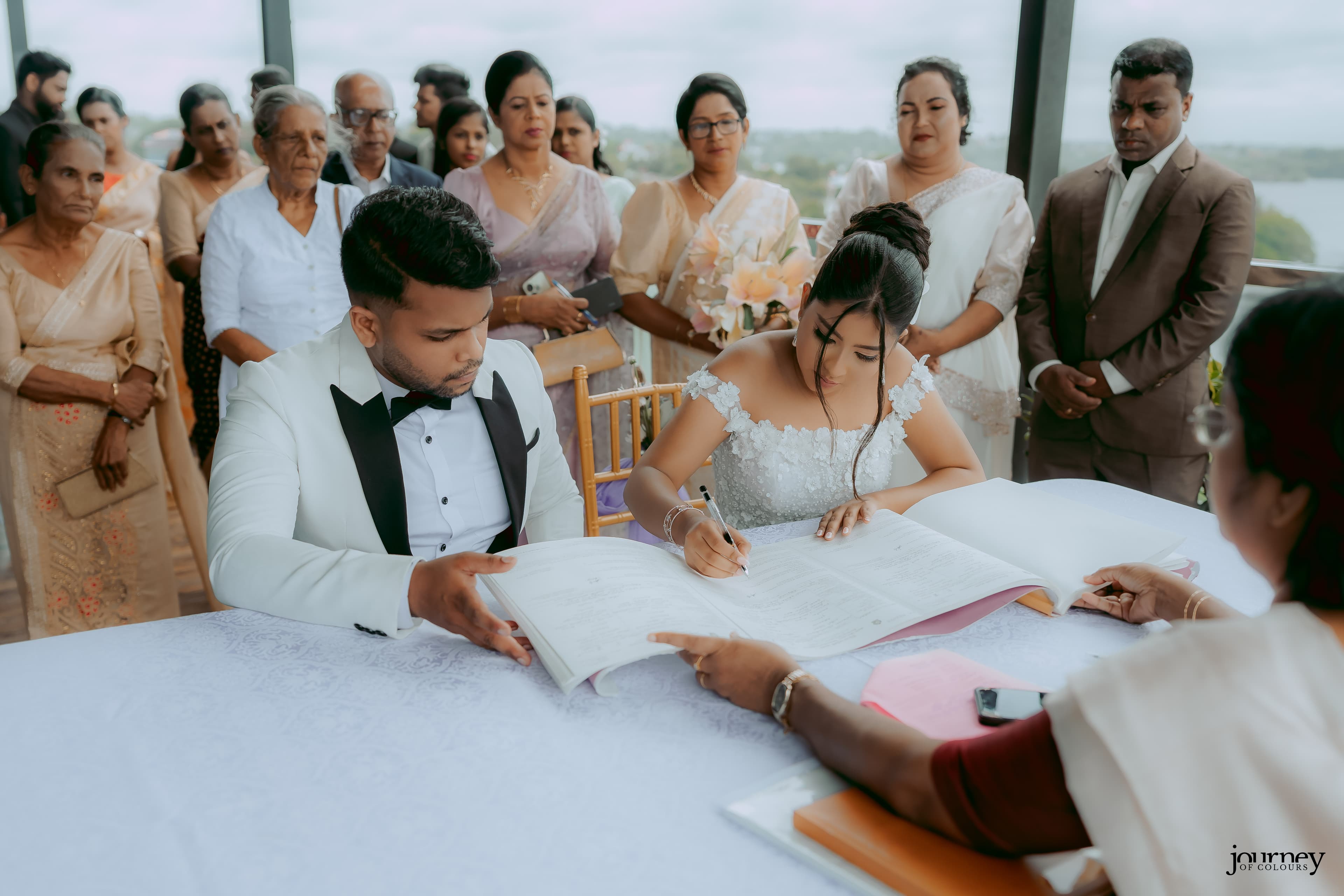Signing engagement paperwork as a couple