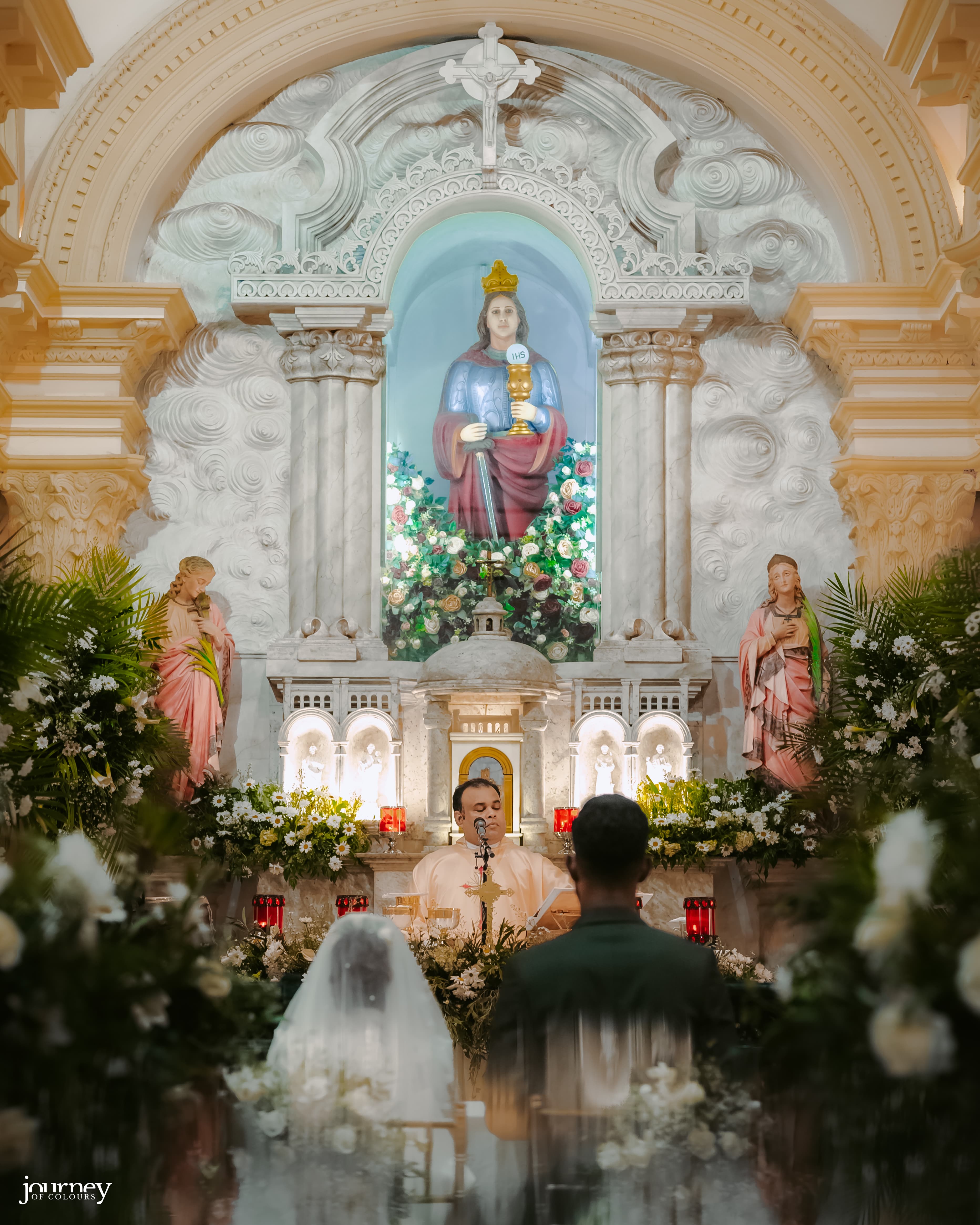 Couple seated before the altar during a church wedding service